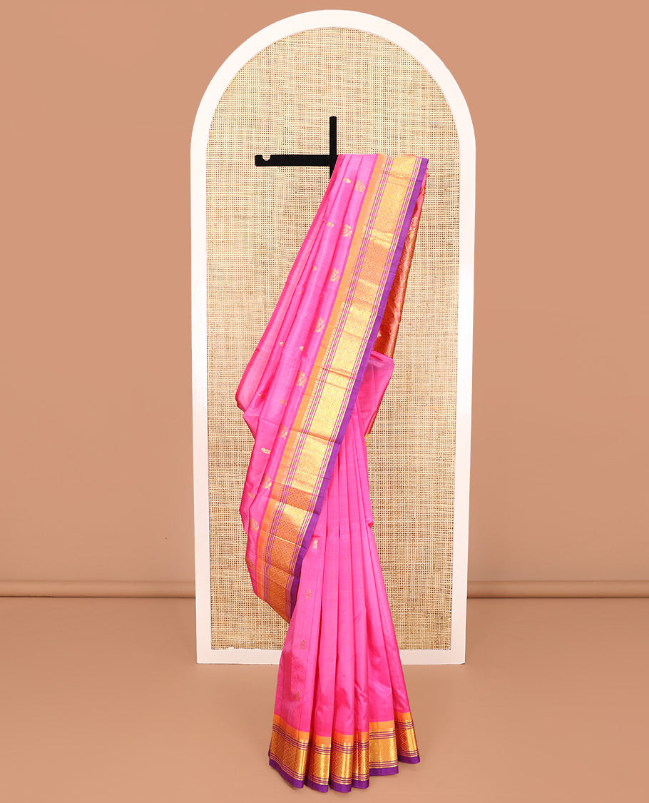 Pink Kanchipuram Silk Saree, Impeccably Styled with Zari Buttas All Over Its Body, Complemented by a Contrast One-Sided Border of Panner Sombu, Banaras, Muthu, and Jaal Designs, Pallu of Floral-Paisley Designs, and Comes Without a Blouse