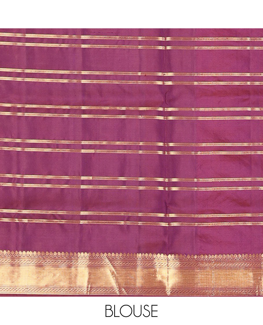 Green butta enclosed checked soft silk saree, zari border of thilakam mokku, banaras, muthu, puli nagam, and vanki designs, and contrast pallu of mayil and yaanai designs