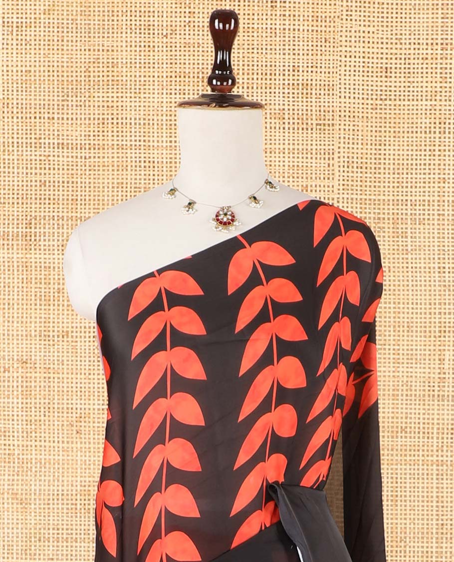 Borderless black half-half style crepe silk saree printed with orange color leaf vine design, leaf motifs printed blouse