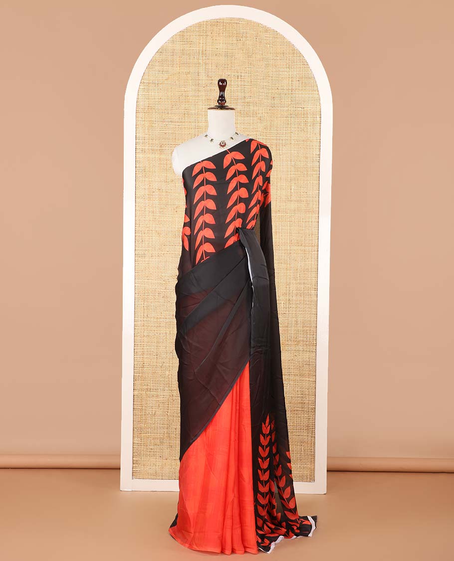 Borderless black half-half style crepe silk saree printed with orange color leaf vine design, leaf motifs printed blouse