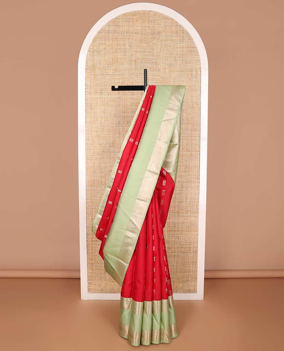 Red buttas silk saree with contrast korvai border of rekk, paun, muthu design & floral design pallu