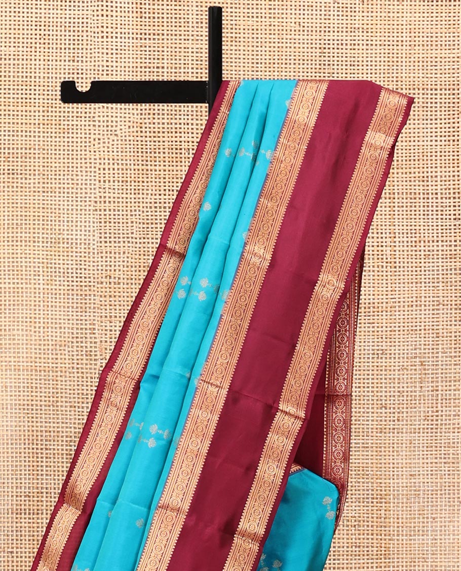 Blue Vasundhara Silk Saree, Graced with Zari Buttas All Over Its Body, Complemented by a Contrast Rettai Pettu Border of Rekku, Muthu, and Chakram Designs, Grand Pallu, and Paired with a Contrast Blouse