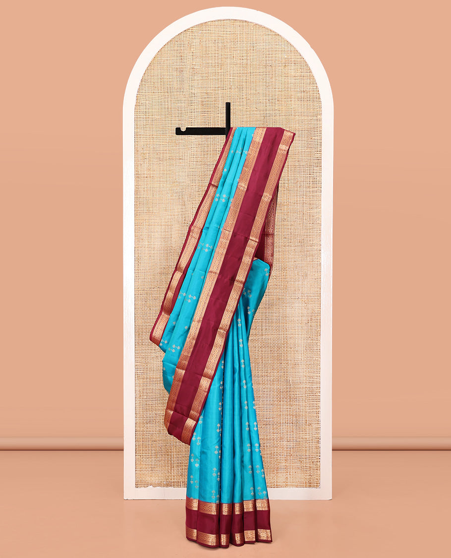 Blue Vasundhara Silk Saree, Graced with Zari Buttas All Over Its Body, Complemented by a Contrast Rettai Pettu Border of Rekku, Muthu, and Chakram Designs, Grand Pallu, and Paired with a Contrast Blouse