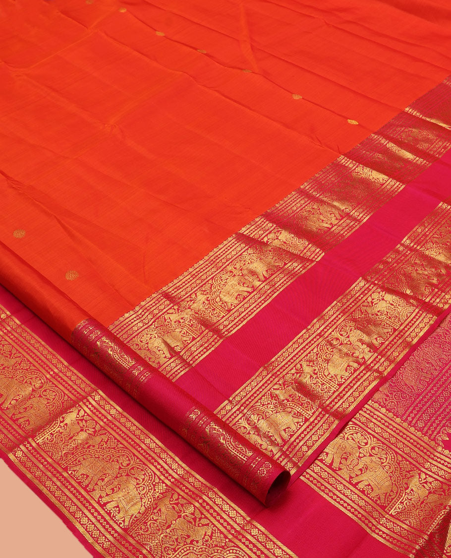 Orange Kanchipuram Silk Saree, Detailed with Zari Buttas, Complemented by Contrast Border of Banaras, Kamalam, and Yaanai Designs, Zari Woven Pallu, and Contrast Blouse