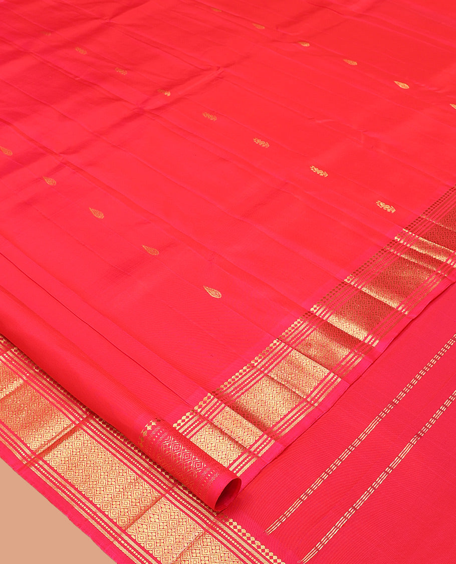 Red Kanchipuram Silk Saree, Decorated with Zari Buttas, Highlighted by a Zari Border of Panner Sombu, Banaras, Muthu, and Jaal Design, Pallu of Zari Design, and No Blouse
