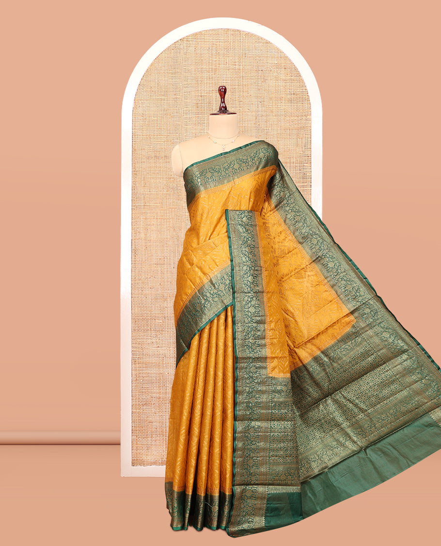 Mustard Tussar Silk Saree Features Zari Designs, Complemented by a Contrast Floral Zari Border, Intricately Designed Pallu, and a Contrast Blouse