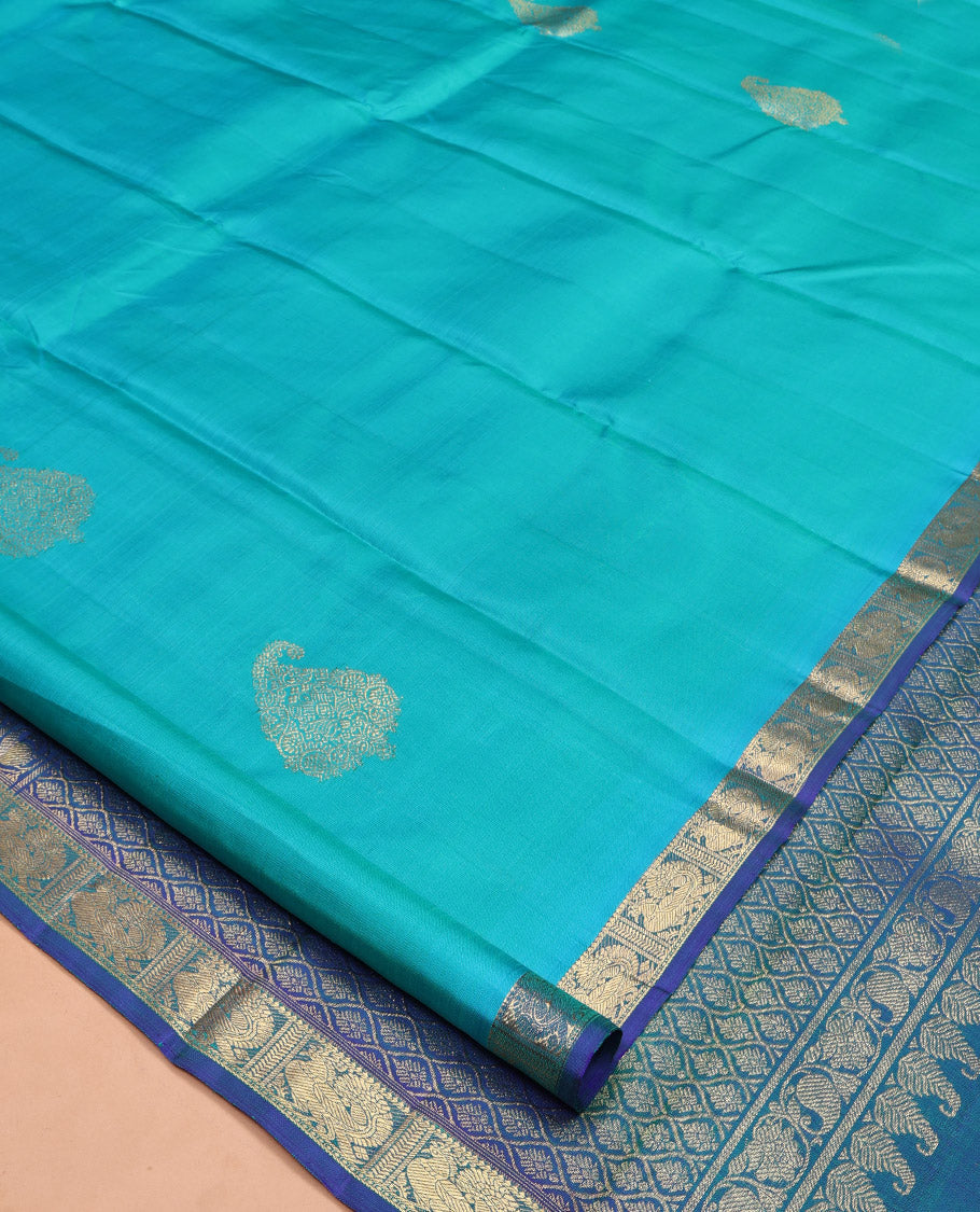 Blue Kanchipuram Silk Saree, Woven with Zari Buttas on Its Body, Complemented by Contrast Border of Annam Designs, Grand Jaal Design Pallu, and Paired with a Contrast Blouse