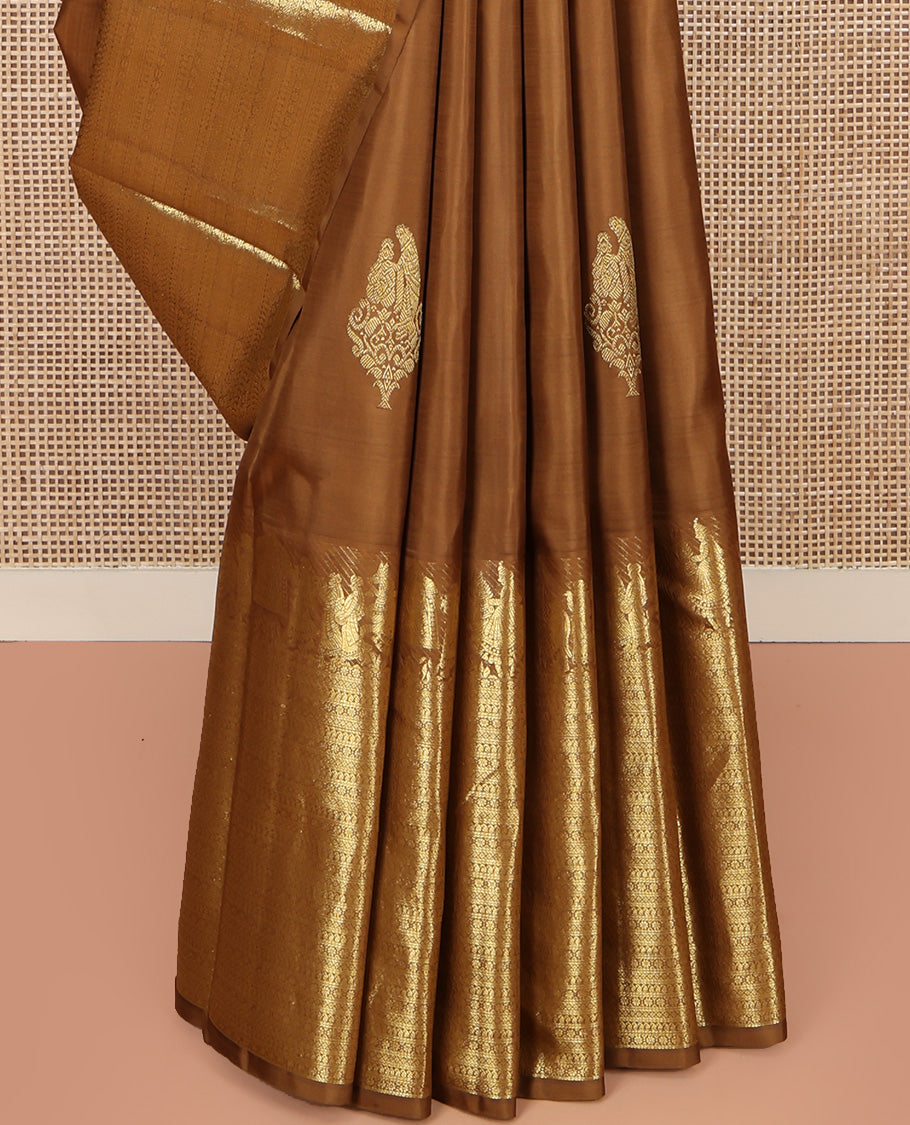 Brown Kanchipuram Silk Saree, Elevated with Zari Buttas All Over Its Body, Highlighted by Zari Wedding-themed Border of Manga, and Kamalam Designs, Grand Jaal Pallu, and Paired with a Matching Blouse