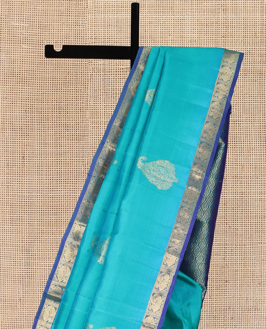 Blue Kanchipuram Silk Saree, Woven with Zari Buttas on Its Body, Complemented by Contrast Border of Annam Designs, Grand Jaal Design Pallu, and Paired with a Contrast Blouse