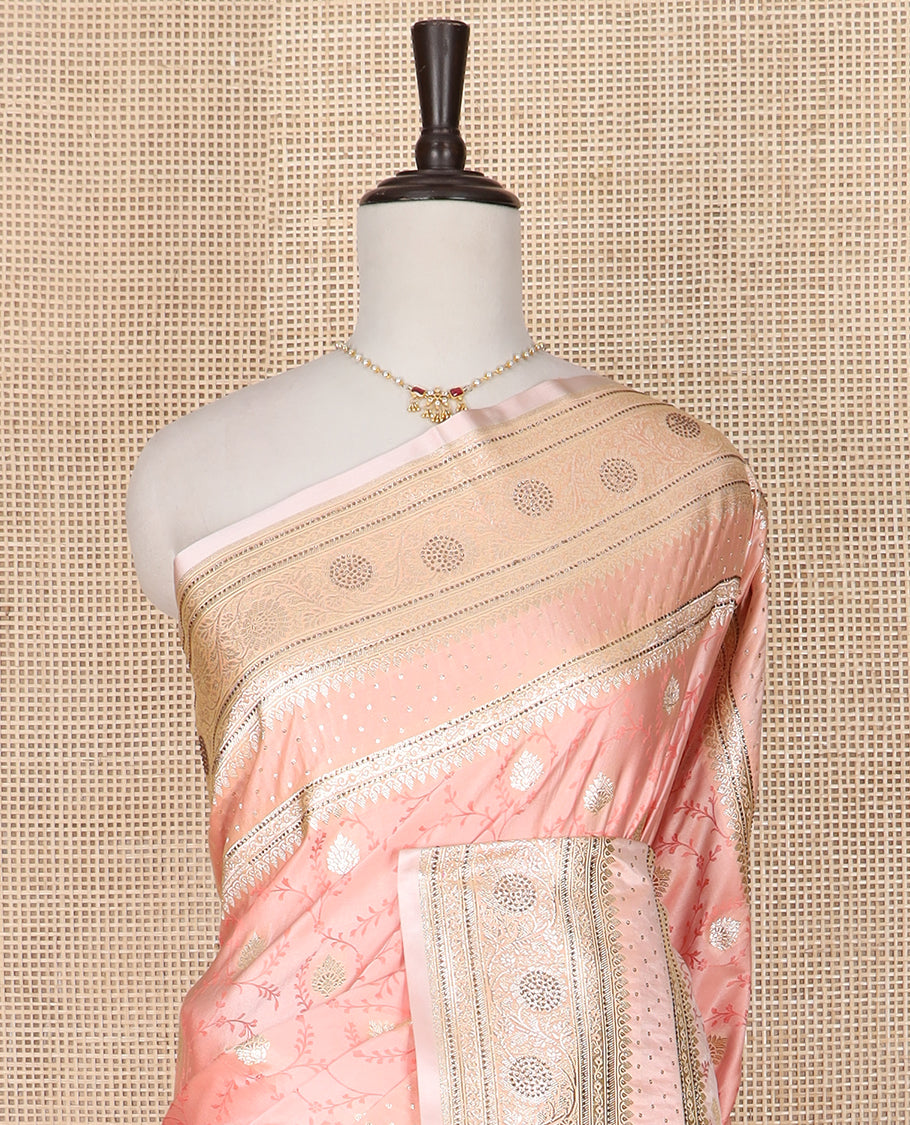 Peach jaal and zari buttas banarasi silk saree, traditional zari border of stone work, and pallu of intricate designs and stone work