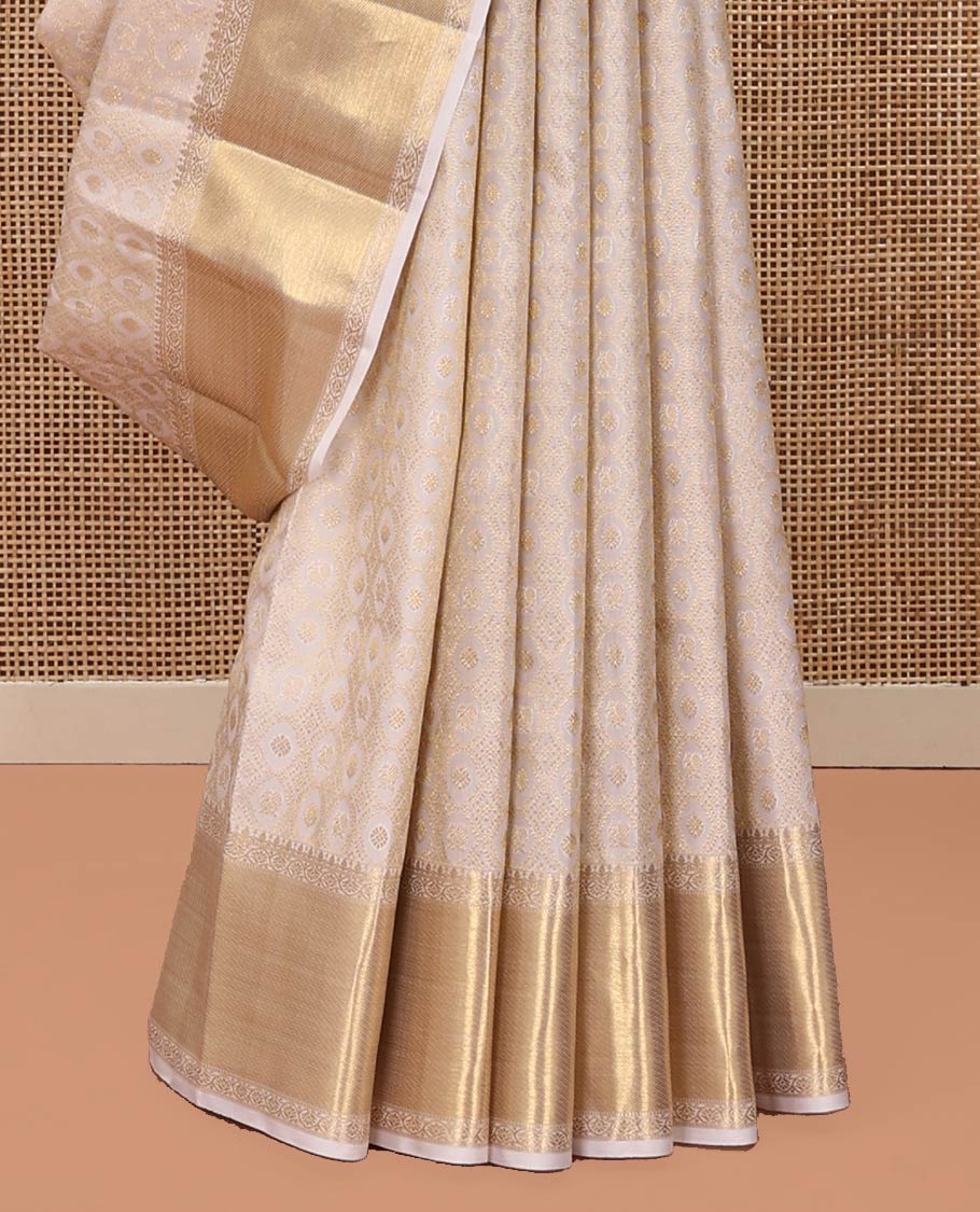 Off-White Kanchipuram Wedding Silk Saree, Finely Woven with Jacquard Design On Its Body, Highlighted by Zari Floral Creeper Design Border, Grand Pallu and Paired with a Matching Blouse