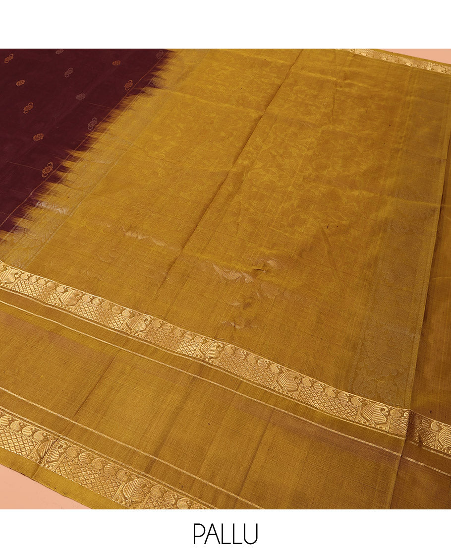 Maroon Uppada Silk Saree Elevated with Zari Buttas All Over Its Body, Complemented by Contrast Traditional Border of Peacock Veenai Designs, Sparsely Woven Pallu of Floral Designs, and Paired with a Contrast Blouse
