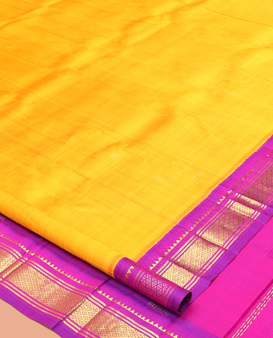 Yellow Kanchipuram Silk Saree, Delicately Woven with Zari Buttas, a Contrast One-Sided Korvai Border of Rekku, Banaras, and Jaal Designs, a Zari Design Pallu, and No Blouse
