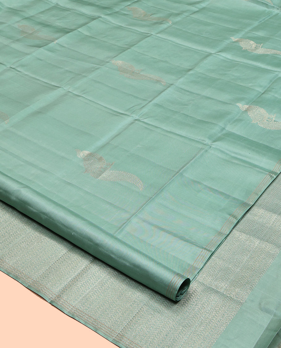 Pale Green Mayuri Soft Silk Saree, Beautifully Bedecked with Kili Buttas, a Subtle Piping Border, Sparsely Woven Pallu, and a Matching Blouse