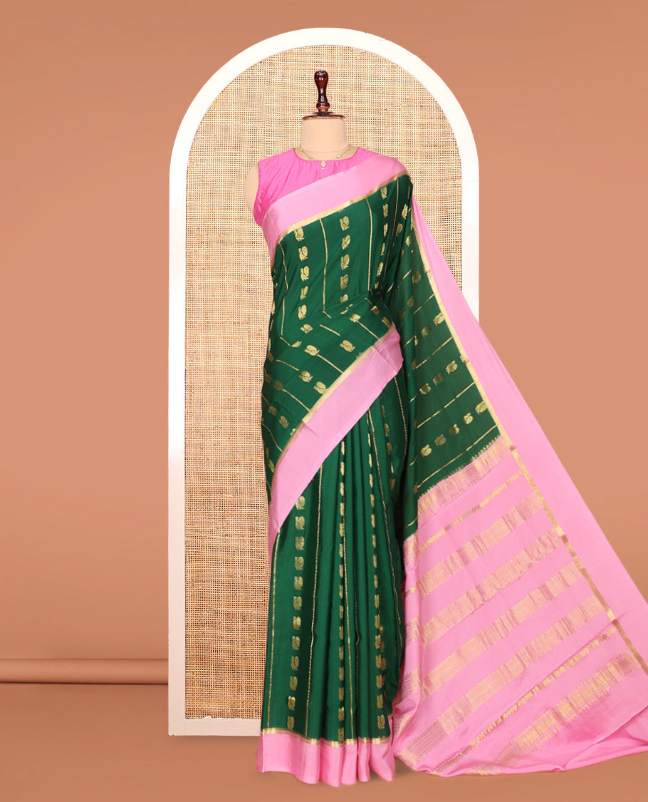 Green Mysore Silk Saree, Adorned With Zari Stripes and Peacock Buttas Across Its Body, Complemented by Captivating Contrast Border of Traditional Zari Designs, Pallu Steeped with Traditional Zari Designs, and Paired with a Contrast Blouse