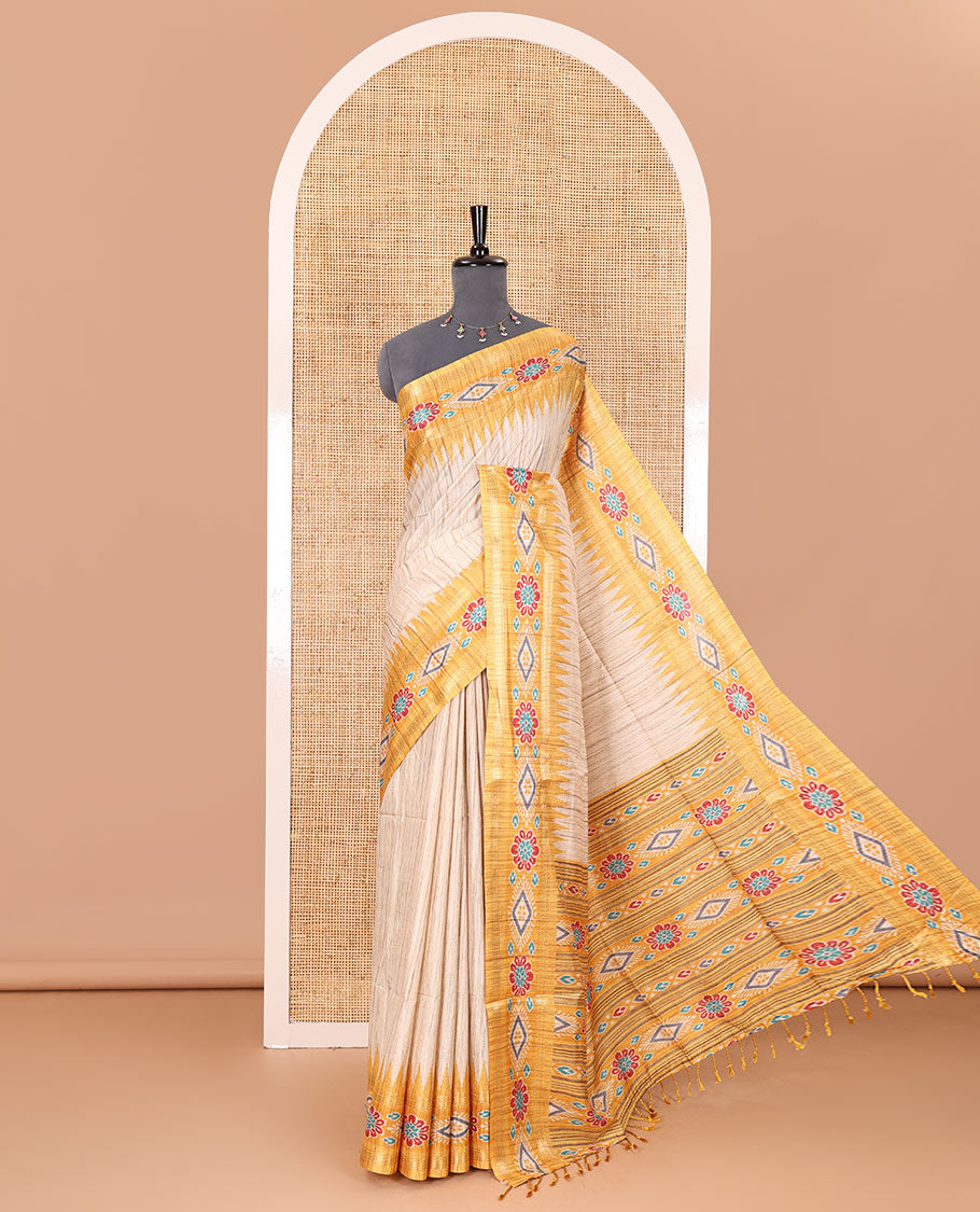 Chikku- yellow plain Katan silk saree, contrast ikkat floral-geometric printed temple border, ikkat printed pallu, and ikkat printed blouse