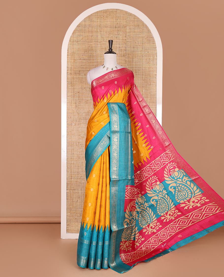 Yellow zari buttas dola silk saree, contrast pink-blue temple ganga jamuna traditional zari border, paisley pallu, and contrast zari design blouse