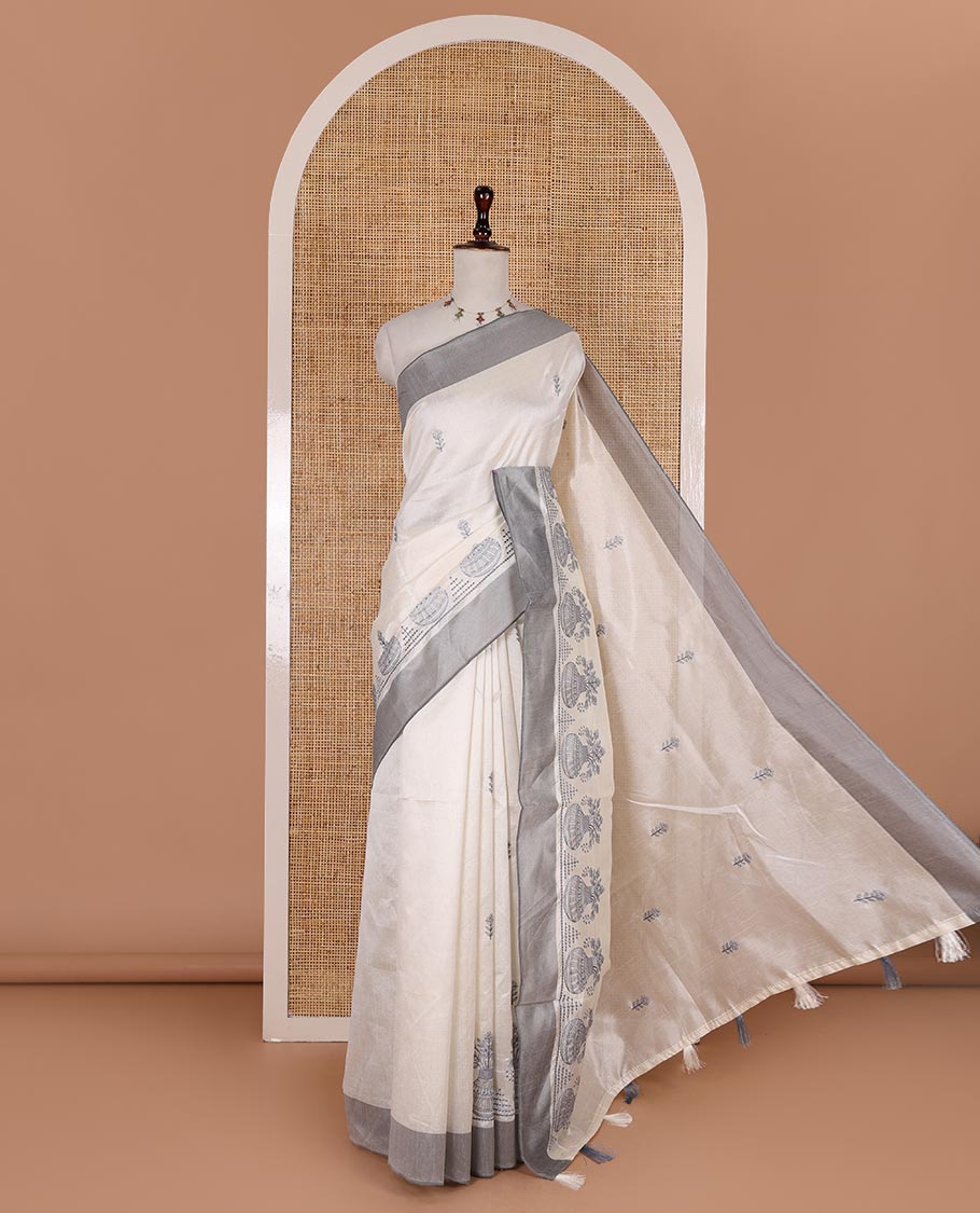 Half-white flower and flower pots motifs thread embroidered semi-tussar saree, contrast grey border, flower motif embroidered pallu, and a matching blouse
