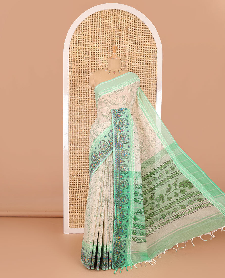 Chikku-green floral, and dear motifs printed mangalagiri cotton saree, contrast resham thread traditional temple border of Madhubani floral-peacock print, printed pallu, and a contrast blouse