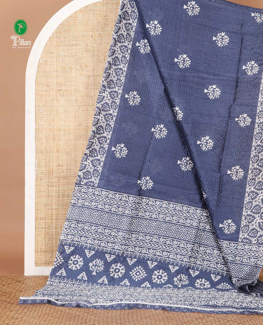 Blue batik-style tree motif printed litch crushed saree, leaf print border, floral-geometric print pallu & floral print blouse