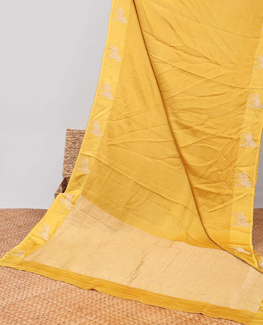 Yellow mushru silk saree with contrast horse motifs border & intricate zari design pallu