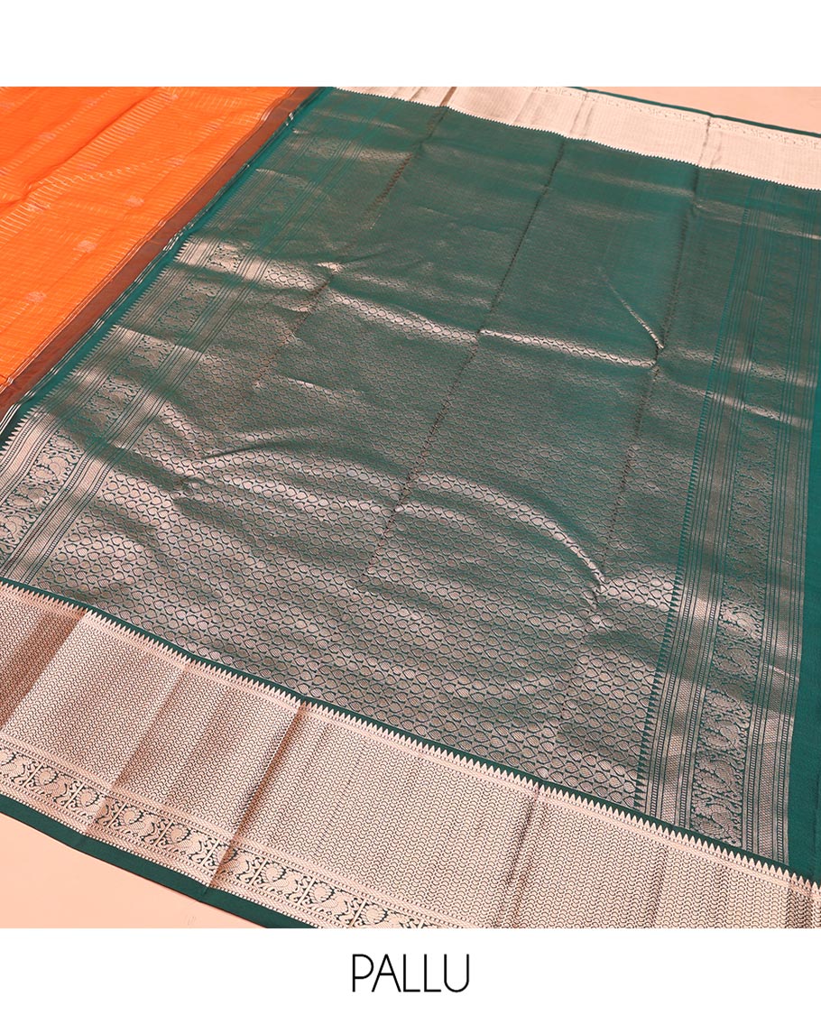 Orange Vasundhara Silk Saree, Embellished with Mayil and Yaali Butta Enclosed Checks on Its Body, Complemented by Contrast Border of Muthu, Rekku, Mayil, and Mayil Kann Designs, Grandly Decked Up Pallu, and Paired with a Contrast Blouse