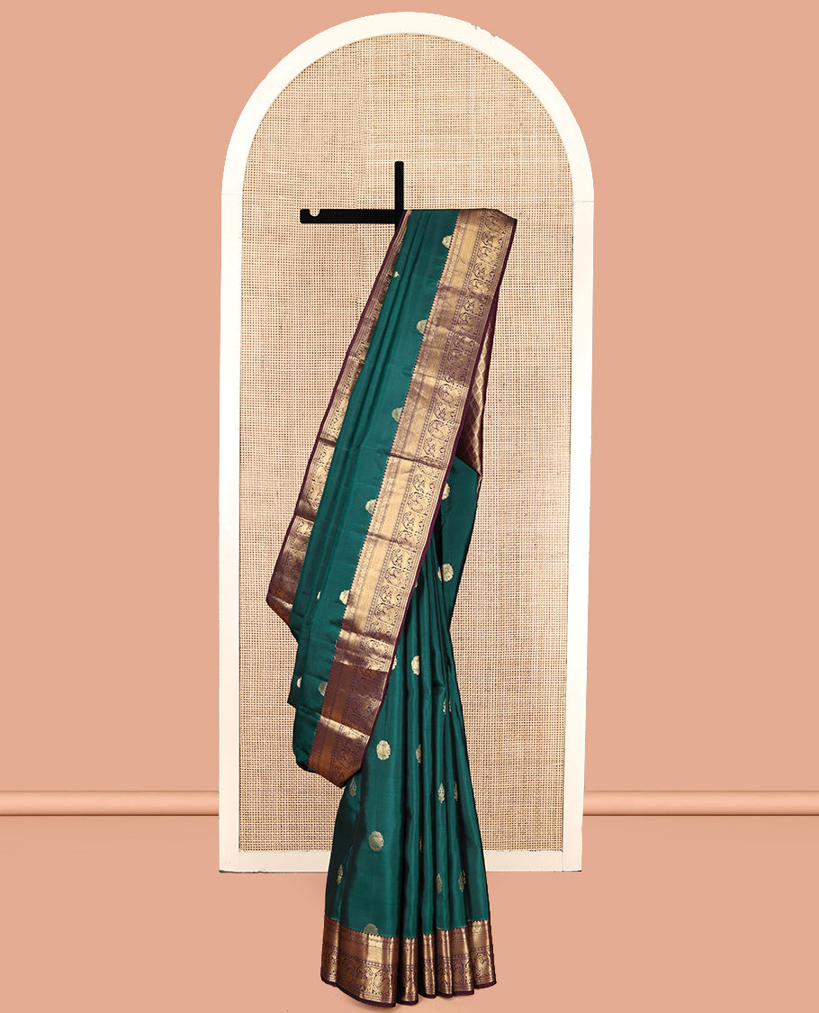 Green Vasundhara Lite Silk Mix Saree, Adorned with Zari Buttas, Contrast Border of Thilakam, Yaanai, Mayil Kann, Muthu, Kamalam, Annam, and Yaali, Jaal Pallu, and a Contrast Blouse