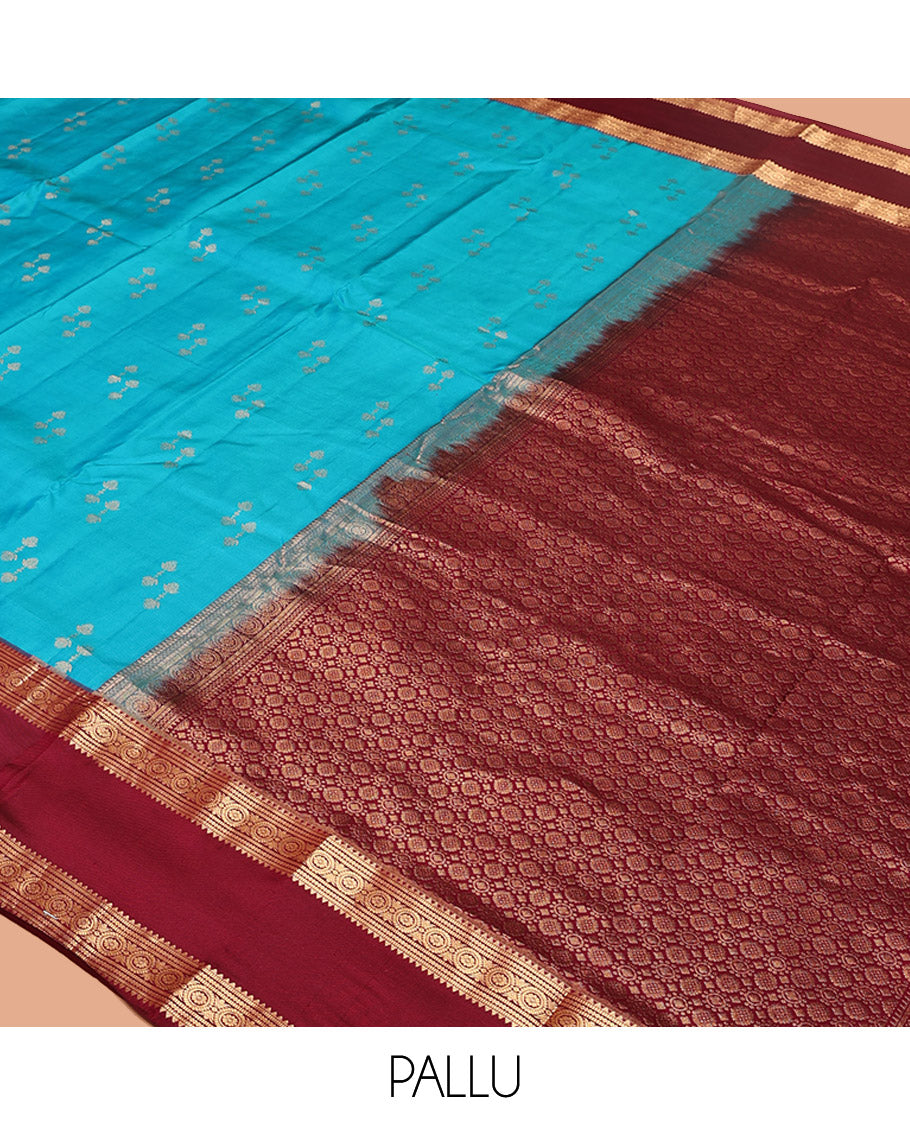 Blue Vasundhara Silk Saree, Graced with Zari Buttas All Over Its Body, Complemented by a Contrast Rettai Pettu Border of Rekku, Muthu, and Chakram Designs, Grand Pallu, and Paired with a Contrast Blouse