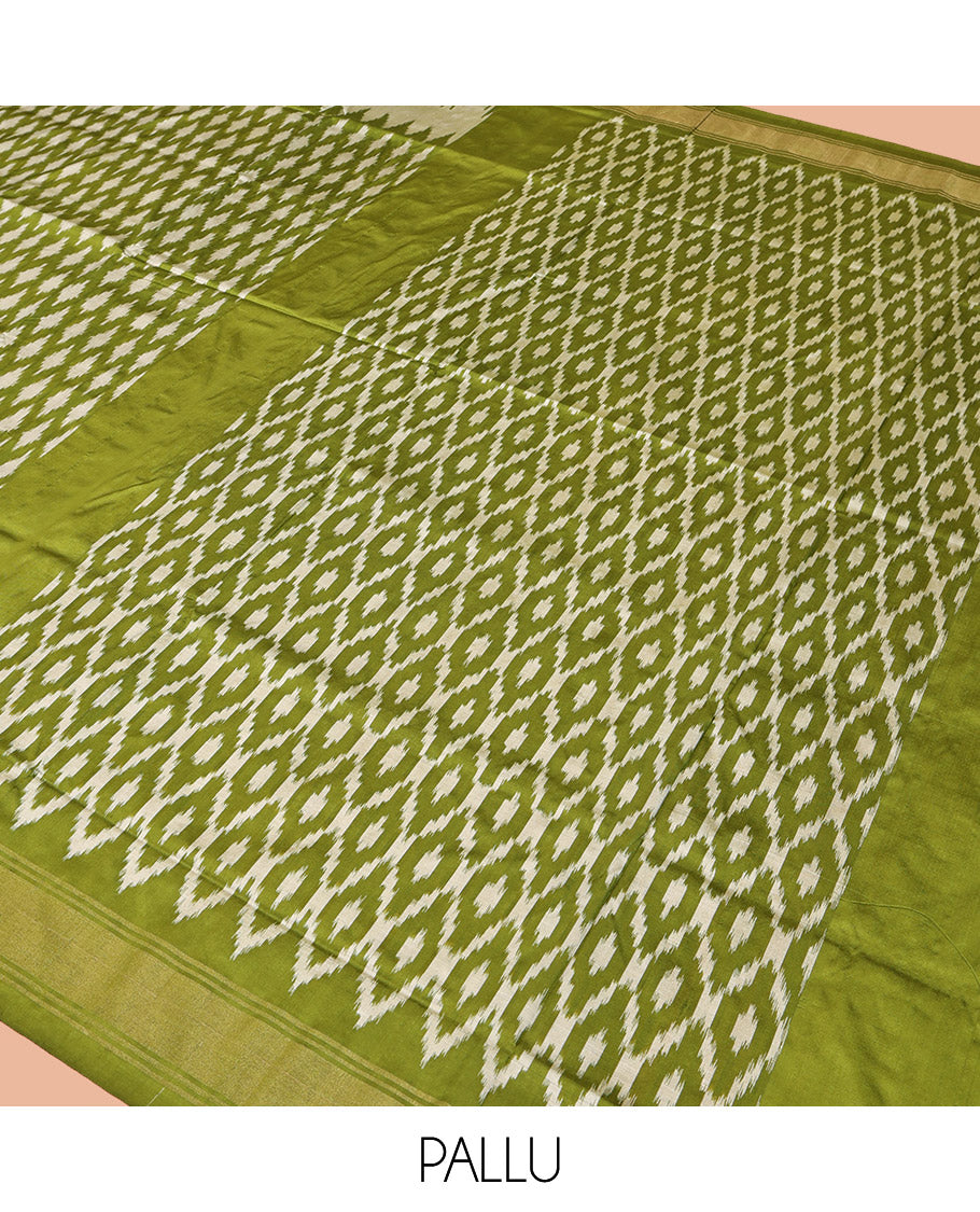 Green Pochampally Ikat Silk Saree, Elevated with Ikkat Buttas on Its Body, Complemented by a Ikkat-Style Woven Temple Border, Pallu of Ogee Patterns, and Paired with a Matching Blouse