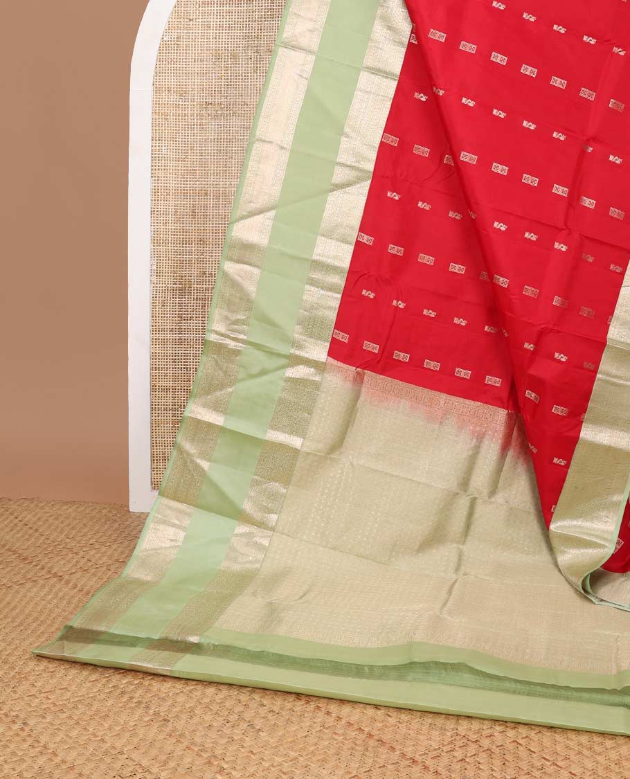 Red buttas silk saree with contrast korvai border of rekk, paun, muthu design & floral design pallu