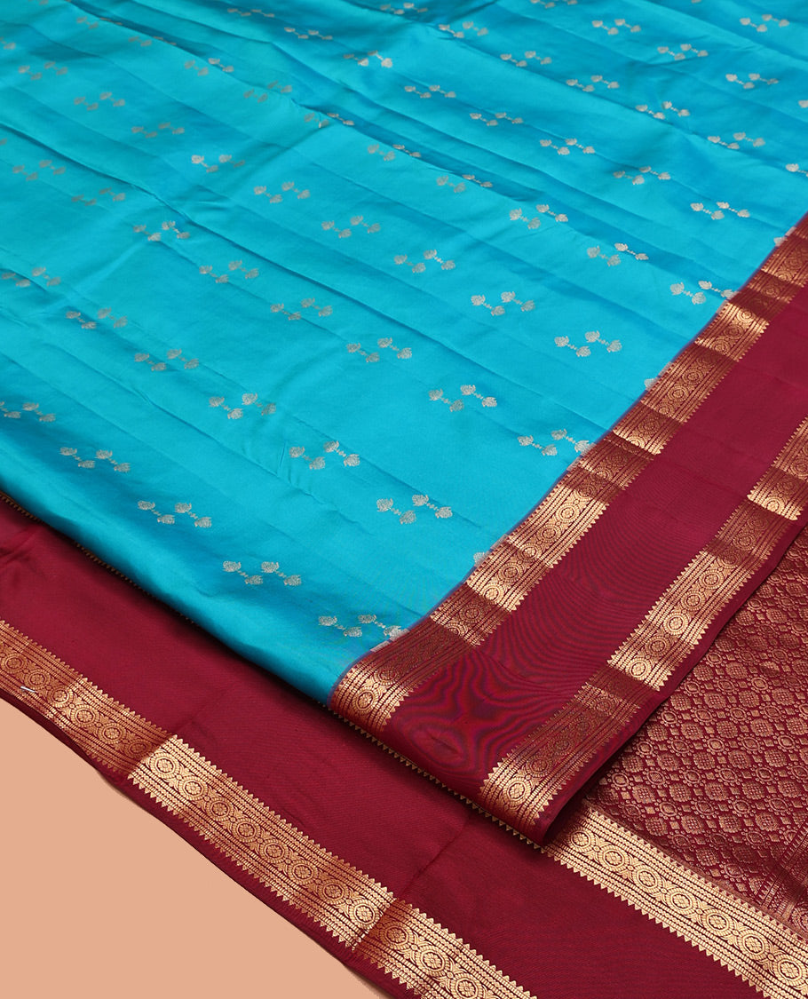 Blue Vasundhara Silk Saree, Graced with Zari Buttas All Over Its Body, Complemented by a Contrast Rettai Pettu Border of Rekku, Muthu, and Chakram Designs, Grand Pallu, and Paired with a Contrast Blouse