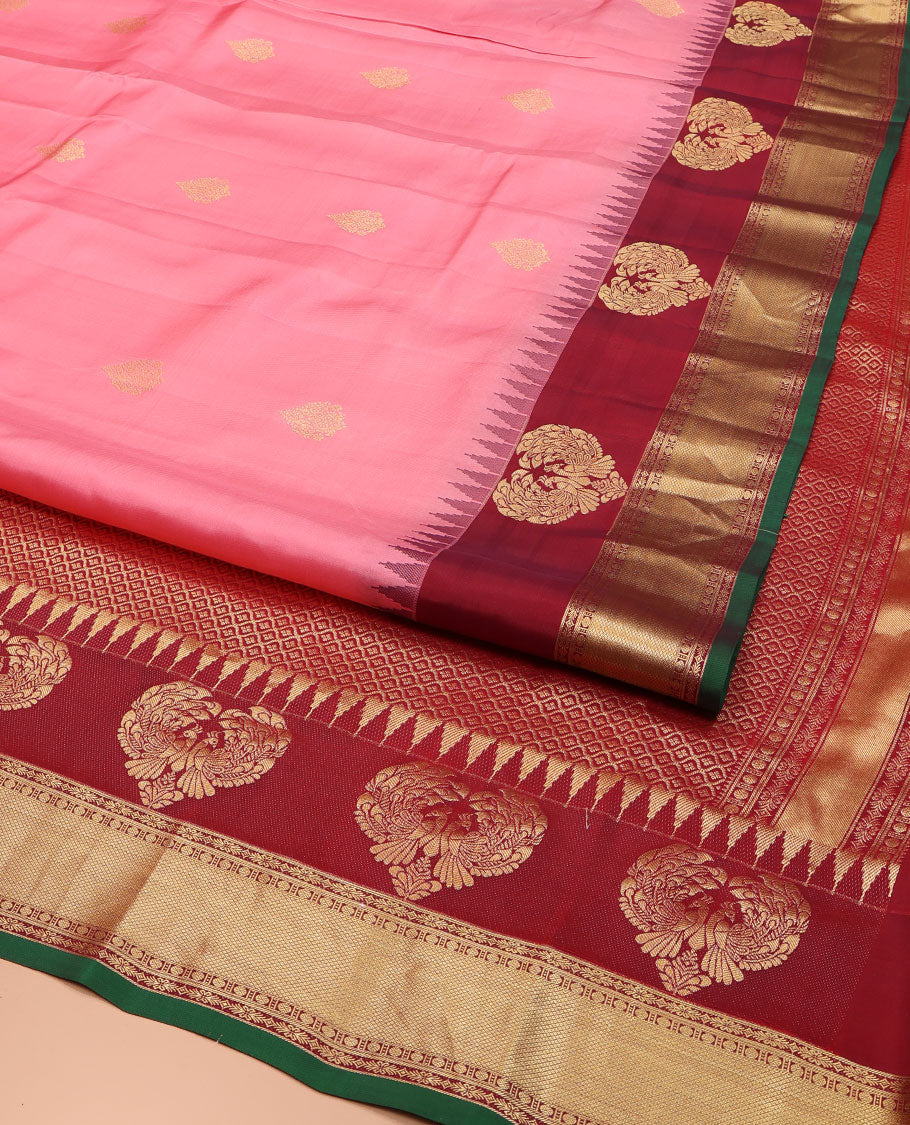 Pink Vasundhara Silk Saree, Finely Designed with Zari Buttas All Over Its Body, Complemented by Contrast Temple Border of Mayil, Rudraksham, and Mayil Kann Designs, Grand Jaal Pallu, and Paired with a Contrast Blouse
