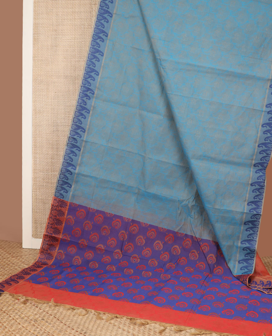 Blue ogee-patterned Coimbatore cotton saree, paisley motif border, & contrast peacock-feather-style motifs pallu