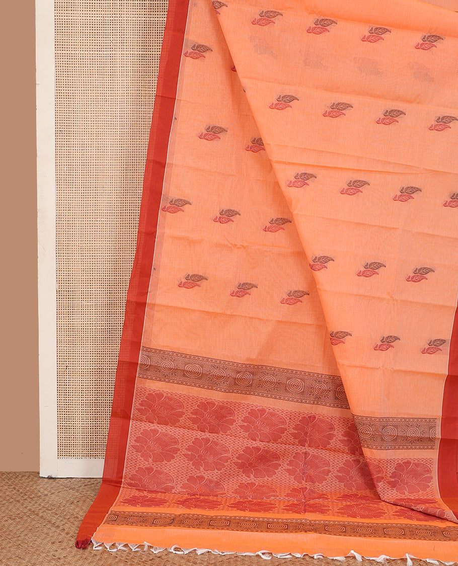 Orange leaf buttas kanchi cotton saree, contrast plain border, and floral design pallu