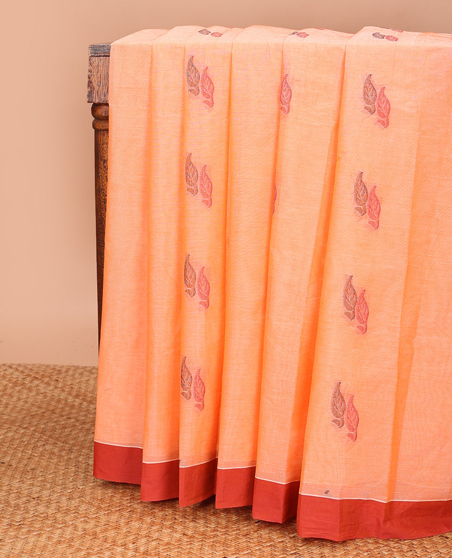 Orange leaf buttas kanchi cotton saree, contrast plain border, and floral design pallu