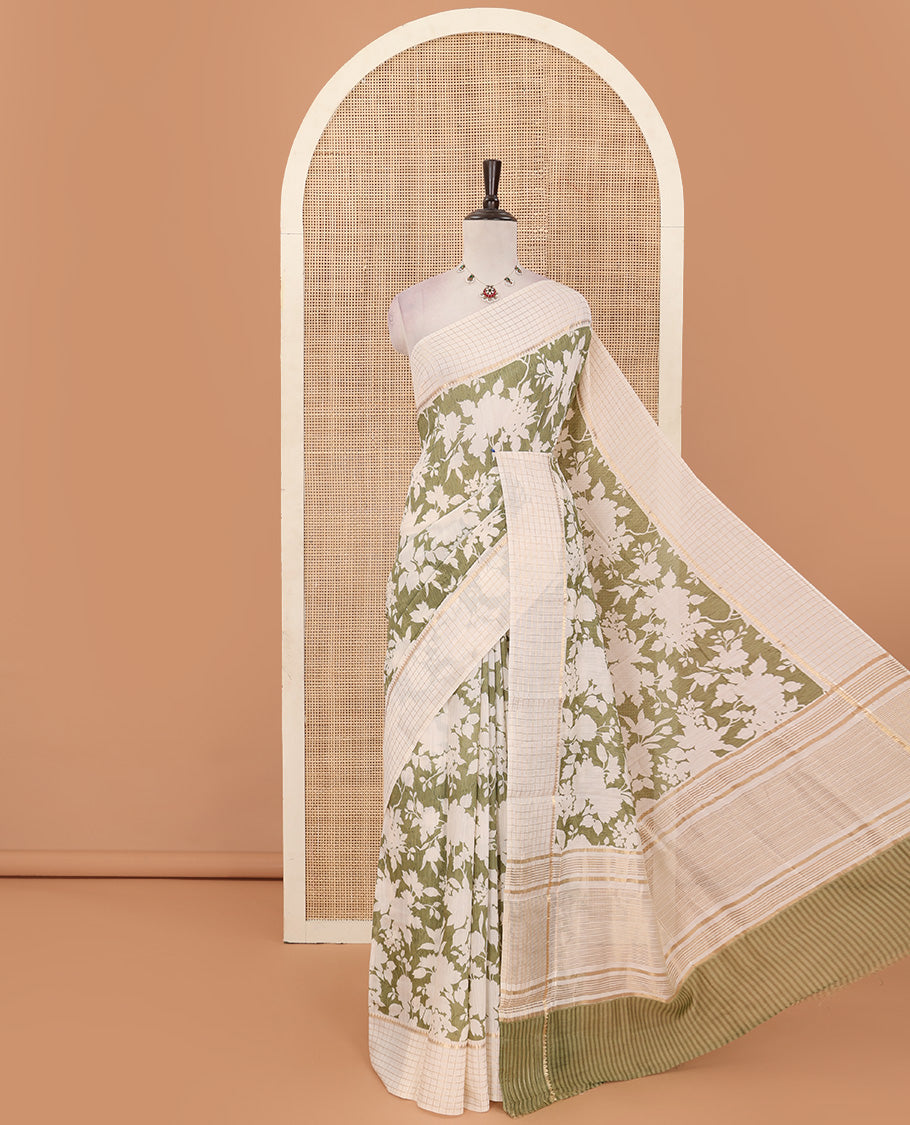 Light olive green silhouettes floral printed Muga silk saree, contrast temple zari checked border, and zari striped pallu