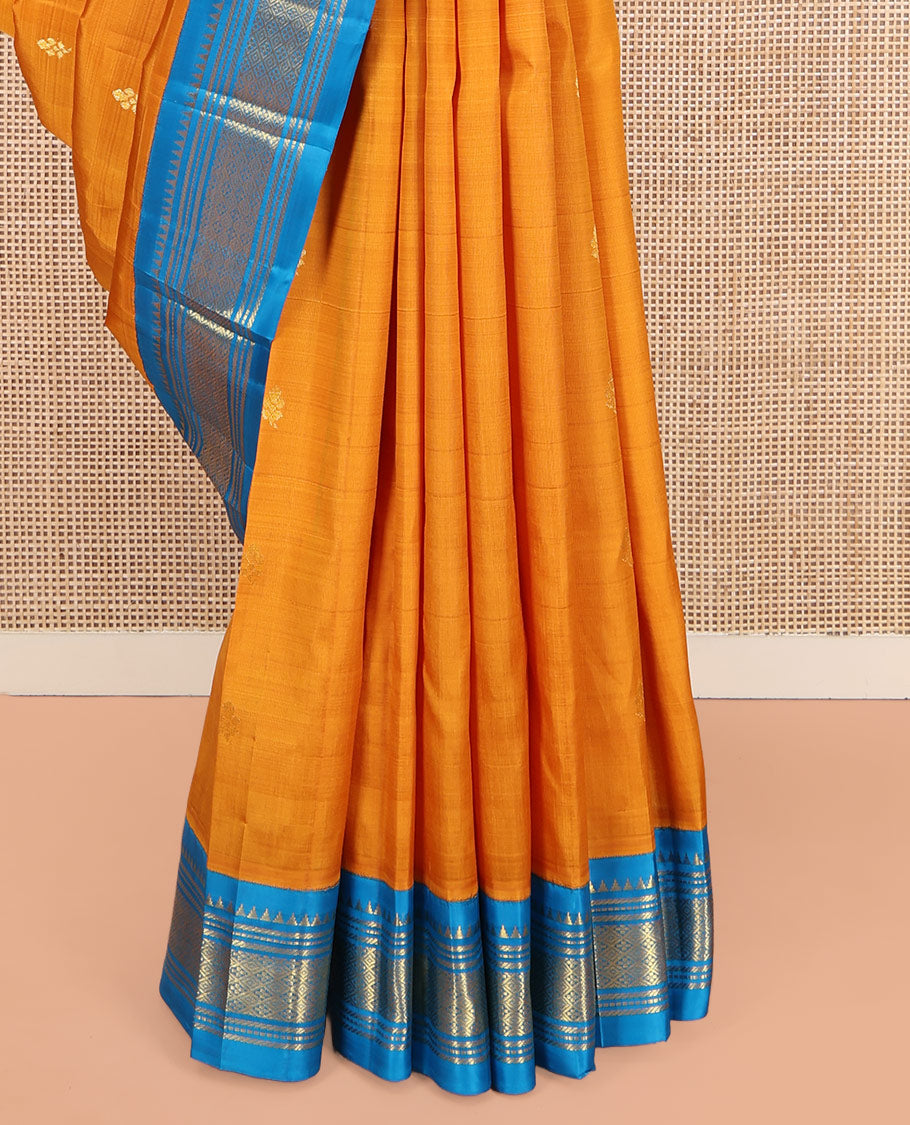 Yellow Kanchipuram Silk Saree, Dazzled with Zari Buttas on Its Body, Complemented by a Contrast One-Sided Korvai Border of Rekku, Banaras, Muthu, and Jaal Designs, Pallu of Zari Designs, and Comes Without a Blouse