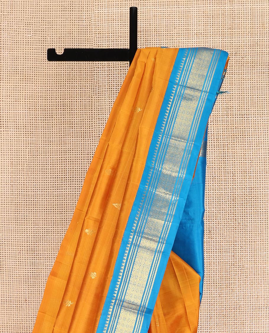 Yellow Kanchipuram Silk Saree, Dazzled with Zari Buttas on Its Body, Complemented by a Contrast One-Sided Korvai Border of Rekku, Banaras, Muthu, and Jaal Designs, Pallu of Zari Designs, and Comes Without a Blouse
