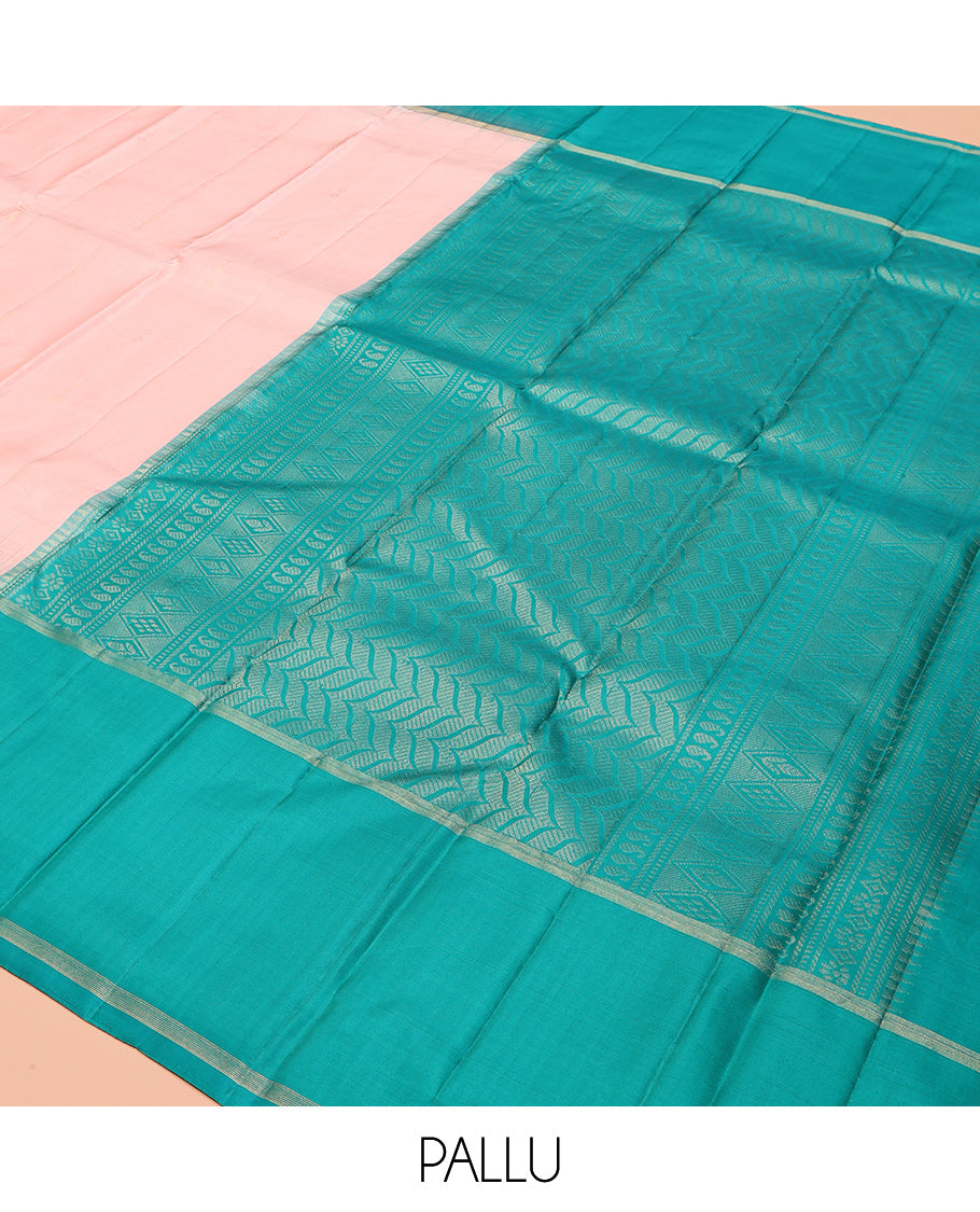 Peach Kanchipuram Silk Saree, Sparsely Woven with Buttas, Complemented by a Contrast Thazampoo Rekku Border, Chevron Striped Pallu, and a Contrast Blouse