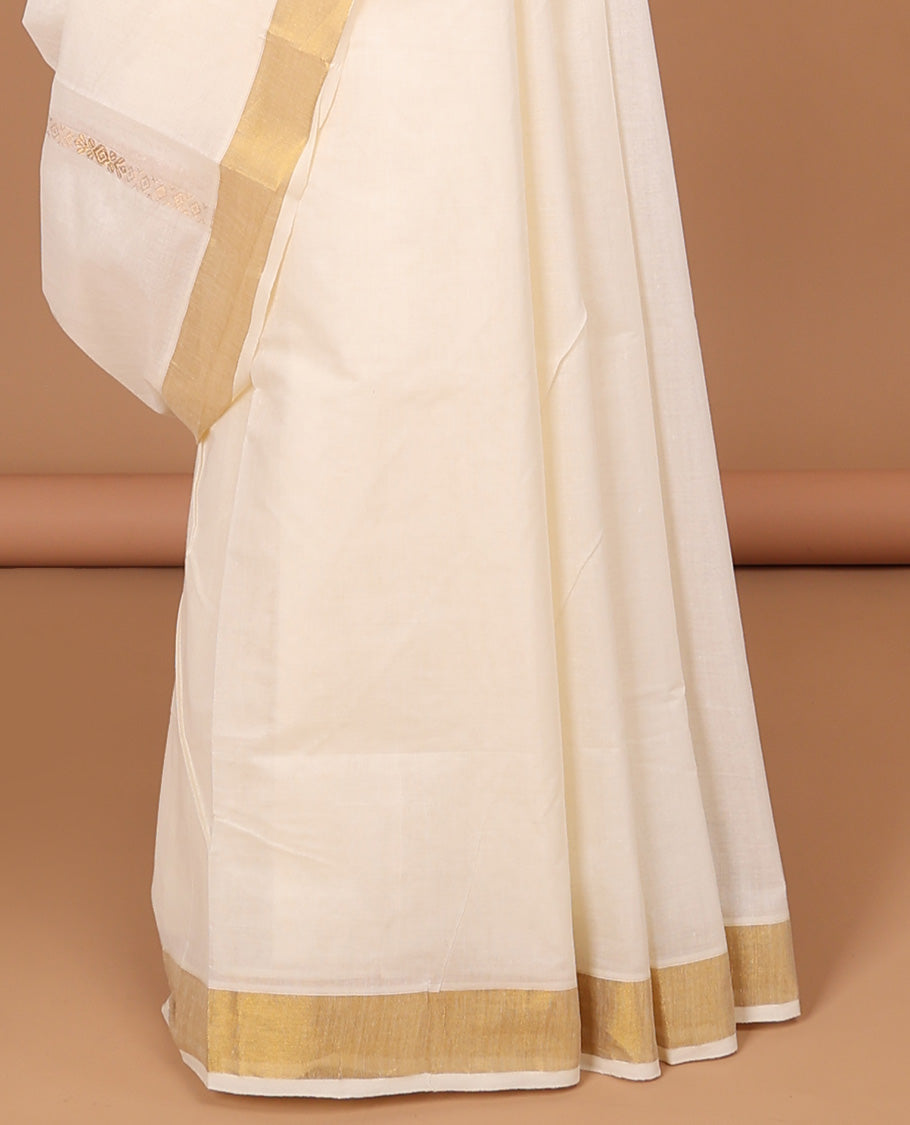 Cream kerala saree with zari designs, zari border & pallu of traditional designs in zari