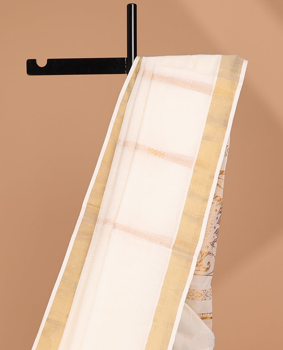 Cream kerala saree with zari designs, zari border & pallu of traditional designs in zari