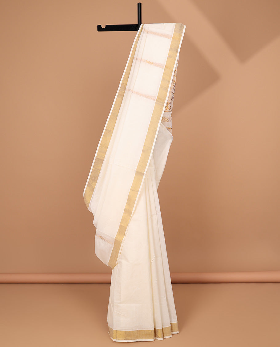 Cream kerala saree with zari designs, zari border & pallu of traditional designs in zari