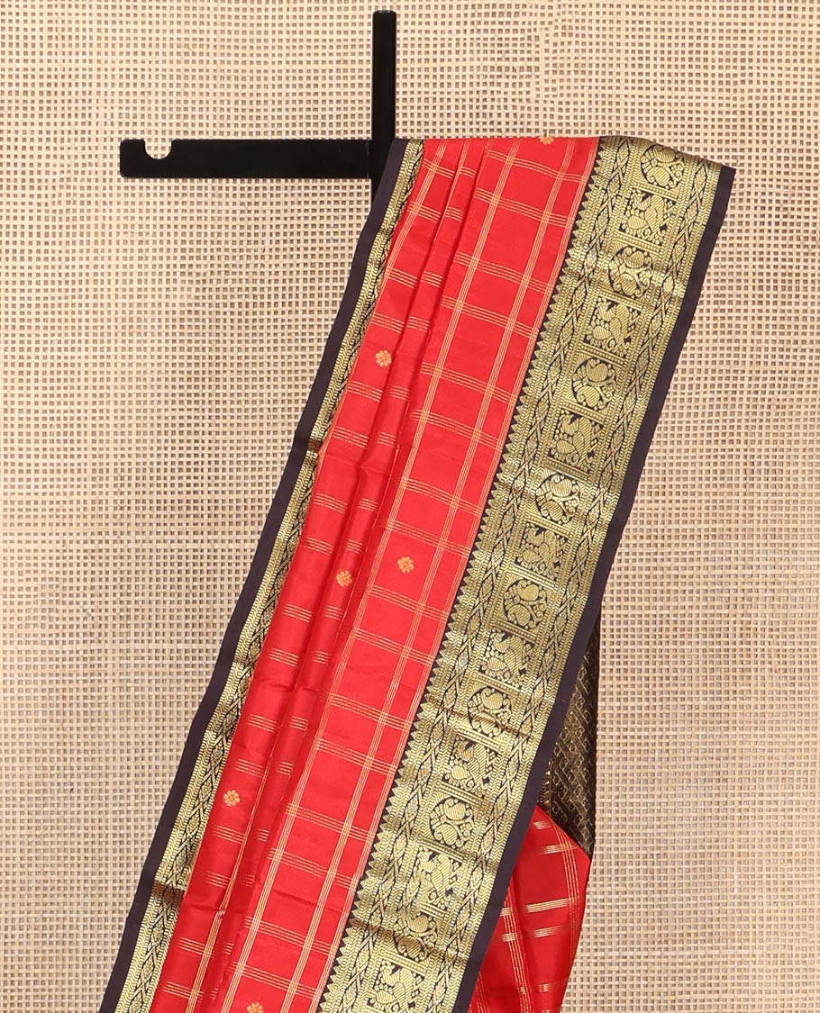 Orange Vasundhara Silk Saree, Richly Detailed with Zari Butta Enclosed Checks All Over Its Body, Complemented by a Contrast Border of Rekku, Muthu, Banaras, Mayil, and Manga Designs, Grand Pallu, and Paired with a Contrast Blouse