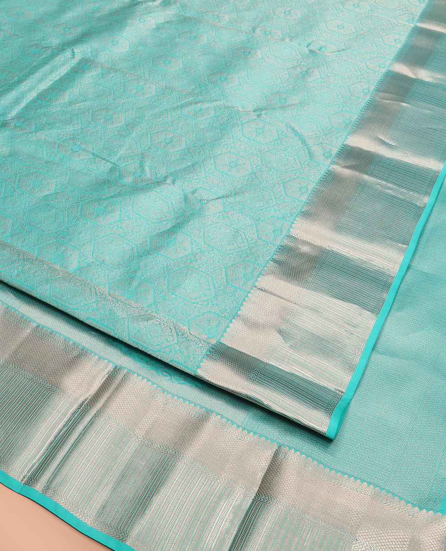 Blue Kanchipuram Wedding Silk Saree Subtly Sparkled with Jacquard Designs, Highlighted with Zari Border of Thilakam Mokku, Banaras, and Mayil Kann Designs, Grandly Zari Woven Pallu, and Paired with a Matching Blouse