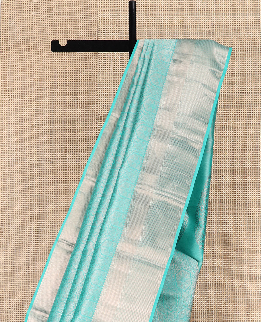 Blue Kanchipuram Wedding Silk Saree Subtly Sparkled with Jacquard Designs, Highlighted with Zari Border of Thilakam Mokku, Banaras, and Mayil Kann Designs, Grandly Zari Woven Pallu, and Paired with a Matching Blouse