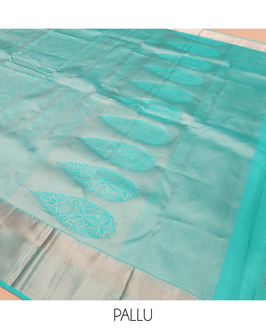 Blue Kanchipuram Wedding Silk Saree Subtly Sparkled with Jacquard Designs, Highlighted with Zari Border of Thilakam Mokku, Banaras, and Mayil Kann Designs, Grandly Zari Woven Pallu, and Paired with a Matching Blouse