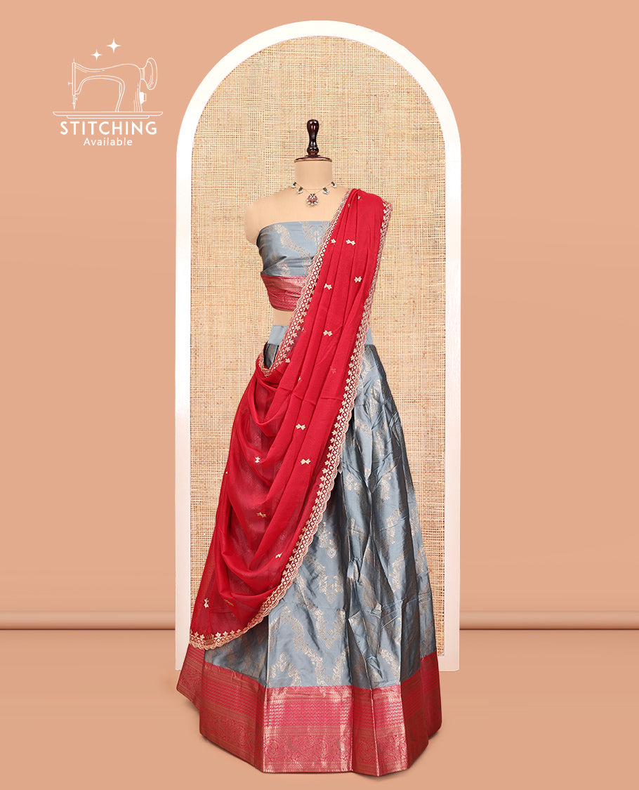 Grey Banarasi Half-Saree, Elevated with Floral Jacquard Design, a Contrast Traditional Zari Border, a Matching Blouse, and a Contrast Embroidered Dhavani