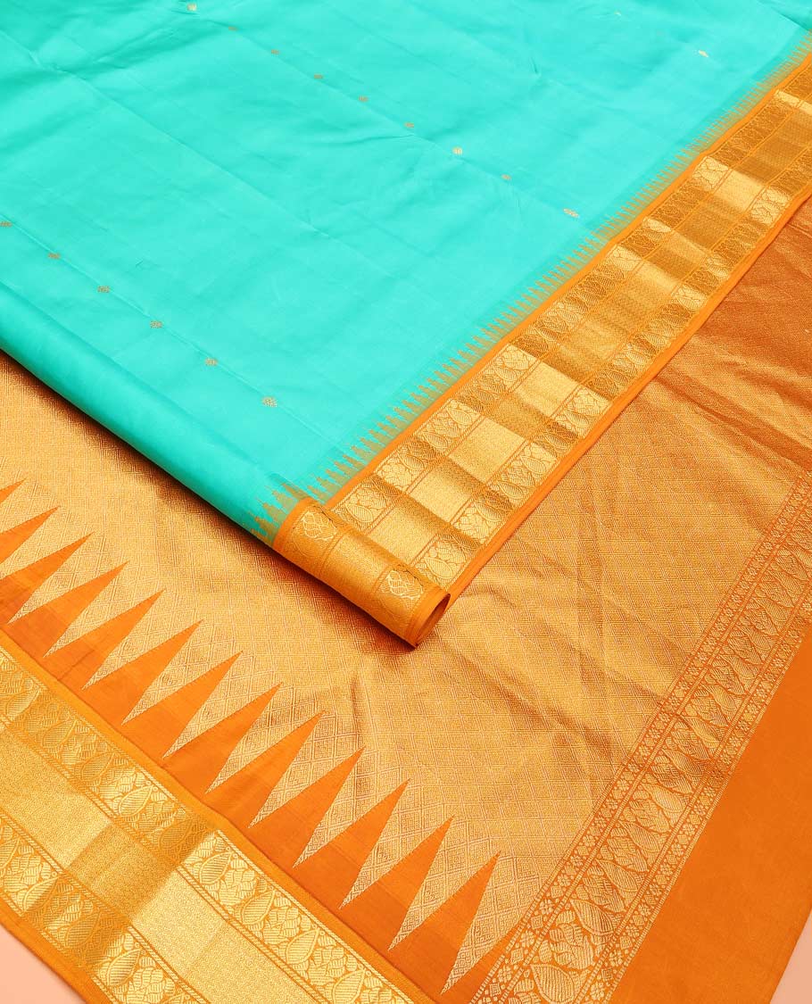 Turquoise buttas Bangalore silk saree, contrast temple traditional zari border, and pallu of jaal designs