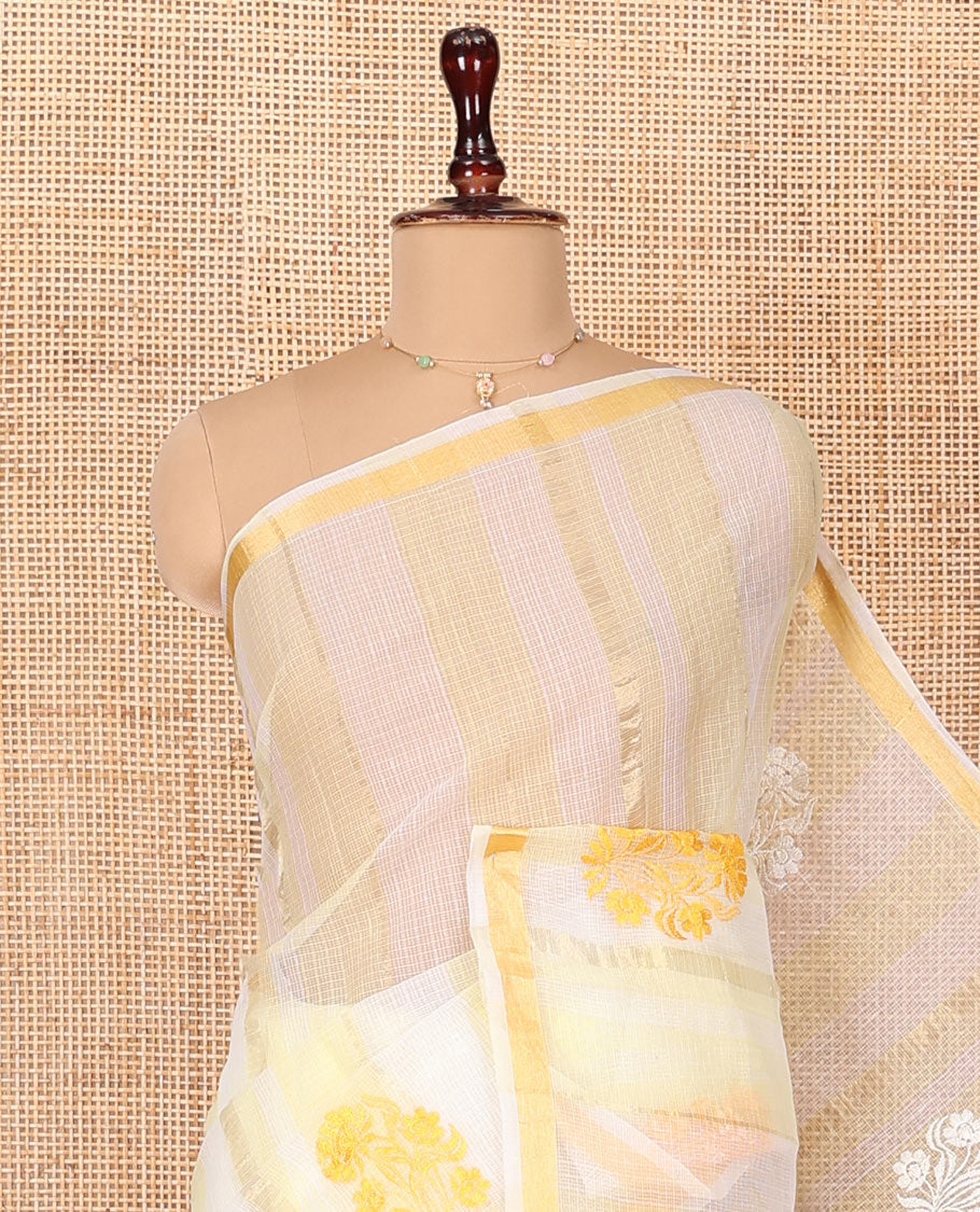 White and Yellow Kota Cotton Saree, Mesmerized with Stripes and Floral Motifs Thread Embroidery on Its Body, Piping Border, Pallu Features Floral Embroidery, and Paired with a Matching Blouse