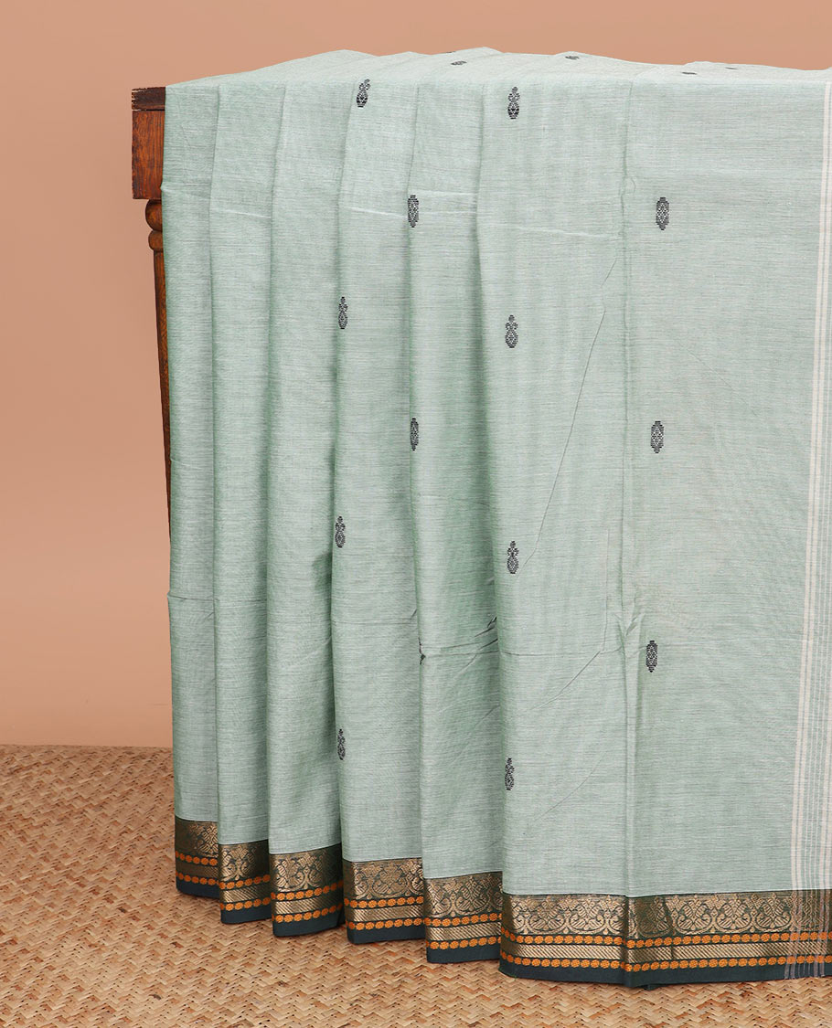 Pastel green thread buttas Chettinad cotton saree, contrast traditional design border, and striped pallu